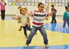 Solomon Laloni and other prekindergarten students perform a dance routine on Wednesday morning