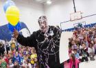 Ernest Sapp is coated in silly string as he accepts his grant monies from the Education Foundation Thursday morning. Sapp is an instructor at Fairview/Jewell and is one of 16 educators from the campus to receive a grant.