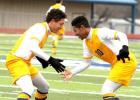 Copperas Cove’s Devante Purnell celebrates a goal with teammate Perry Cannon Jr. (10) during their 3-0 shutout of Salado during a scrimmage tournament Saturday at Bulldawg Stadium. Cove won both games in the tournament with the second coming in a 2-0 blanking of Connally.