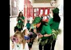 Williams/Ledger Elementary kindergarten students use their “leprechaun finders” which are foam magnifying glasses to hunt for Louie, the leprechaun, and find the pot of gold at the end of the rainbow. – COURTESY PHOTO