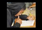 CCHS Senior basketball player Eric Braddock tests his English knowledge on a worksheet in a tutoring session he attends voluntarily to improve his test scores to get into college.