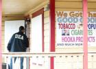 An agent from the Drug Enforcement Agency makes his way into the Smoke Shack in Copperas Cove as he helps confiscate more than $19,000 in cash and $40,000 worth of illegal synthetic marijuana.