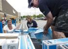 Donald Vess loads his truck with fans with the help of Chamber of Commerce Ambassadors Nicole Vess and Brenda Wilson following a food and fan drive that netted nearly two dozen fans for the seniors of Copperas Cove.