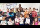 Third grade students in Denise Carmichael’s class at House Creek Elementary School show off their newly published books containing their opinions of bullying. Students were involved in the entire writing process to prepare and create the book including brainstorming a topic as a class and outlining the story elements of the book.