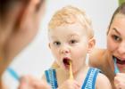 Teaching children to brush at a young age helps improve the habit of keeping the pearly whites healthy.