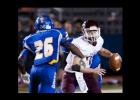 Copperas Cove defenders Michael Sumrall (26) and Tyrell Thompson harass A&M Consolidated quarterback Mason Hickson in the first half of the Dawgs 62- 38 win Friday at Bulldawg Stadium.