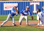 Copperas Cove senior Bryce Delano slides into second base as Temple’s Reid Hesse and Ricky Ortiz await the throw during the first inning of Friday’s game at Temple. The Wildcats edged the Bulldawgs 4-2.