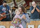 James Wright dances with his daughter Magnolia to the sounds of Justin Bravo & the Kind during a benefit for Texas Angel Tattoos and Rocky Hughes. Wright played with Rust Bucketz and Elution as five bands preformed on the night.