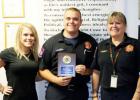 Dylan Karl, center, was honored as the firefighter of the quarter by the morning exchange club. Presenting him for the award is Captain Carla Polidoro and his fiancee Jamie McCartney.