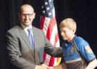 William Horton shakes the hand of Coryell County District Attorney Dusty Boyd after accepting his certificate of completion from Law Enforcement Explorers Program Friday evening.