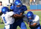 Copperas Cove running back Trent Canion is tackled by defenders Shamad Lomax (8) and Jace Leimbach during the Soap, Shampoo and Towel intrasquad scrimmage on Saturday at Bulldawg Stadium. The team will hit the road for their first scrimmage against another team.