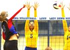 Copperas Cove’s Raven Dickerson (5) and Megan Diaz leap for a block attempt against Midway hitter Allison Jones during their 2.5 hour, five-set contest Tuesday at Bulldawg Gymnasium. The Pantherettes won 3-2 (30-32, 25-21, 25-20, 22-25, 6-15).