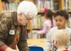 Marianne McDonnell helps kindergarten students browse through books as they select one to keep. The Copperas Cove Retired Teachers Association donated close to 600 books to the students of the district throughout the school year.