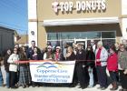 Members of the Copperas Cove Chamber of Commerce celebrate the opening of Top Donuts’ second location in Copperas Cove.